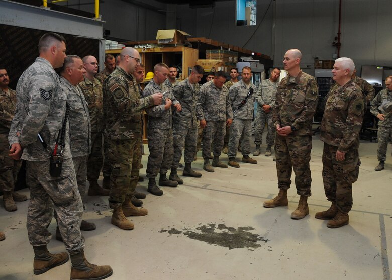 Lt. Gen. Scott Rice, director of the Air National Guard, and Chief Master Sgt. Ronald Anderson, command chief master sergeant of the Air National Guard, conduct a question and answer session with Airmen at Al Dhafra Air Base, United Arab Emirates Dec. 26, 2017. Rice expressed his gratitude for Guardsmen deployed during the holidays.