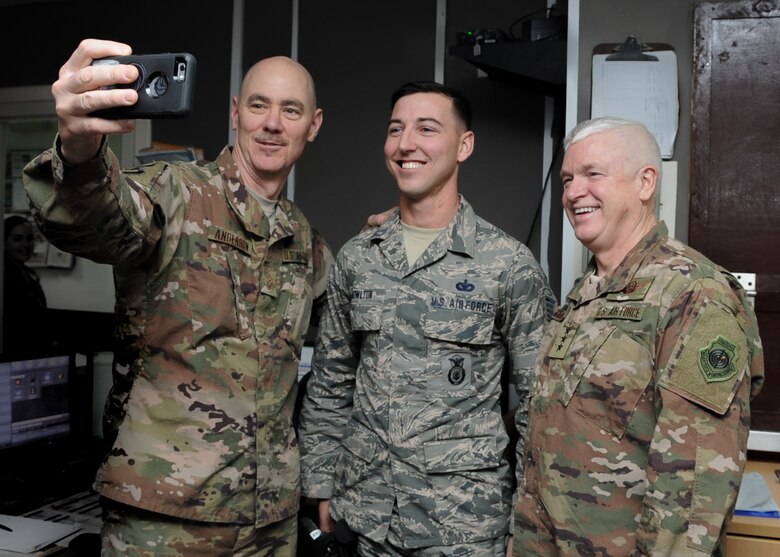 Lt. Gen. Scott Rice, director of the Air National Guard, and Chief Master Sgt. Ronald Anderson, command chief master sergeant of the Air National Guard, conduct a question and answer session with Airmen at Al Dhafra Air Base, United Arab Emirates Dec. 26, 2017. Rice expressed his gratitude for Guardsmen deployed during the holidays.