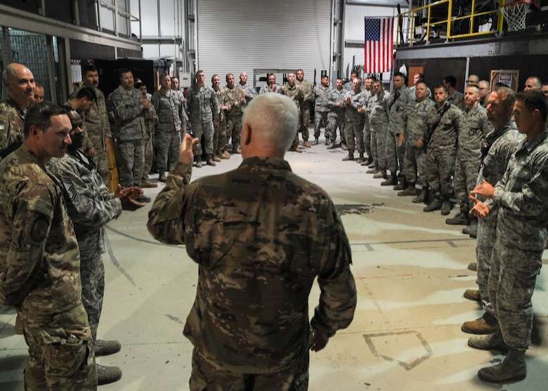 Lt. Gen. Scott Rice, director of the Air National Guard speaks with Guardsmen assigned to the 380th Expeditionary Civil Engineering Squadron at Al Dhafra Air Base, United Arab Emirates Dec. 26, 2017. Rice spoke with Citizen Airmen about the unique challenges concerning Guardsmen and their families during the holidays. 
(U.S. Air National Guard Photo by Staff Sgt. Colton Elliott)