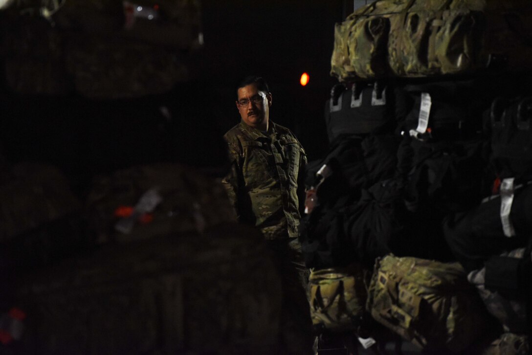 435 AEW, 86 LRS Airmen load pallets near the Ramstein Air Base flight line