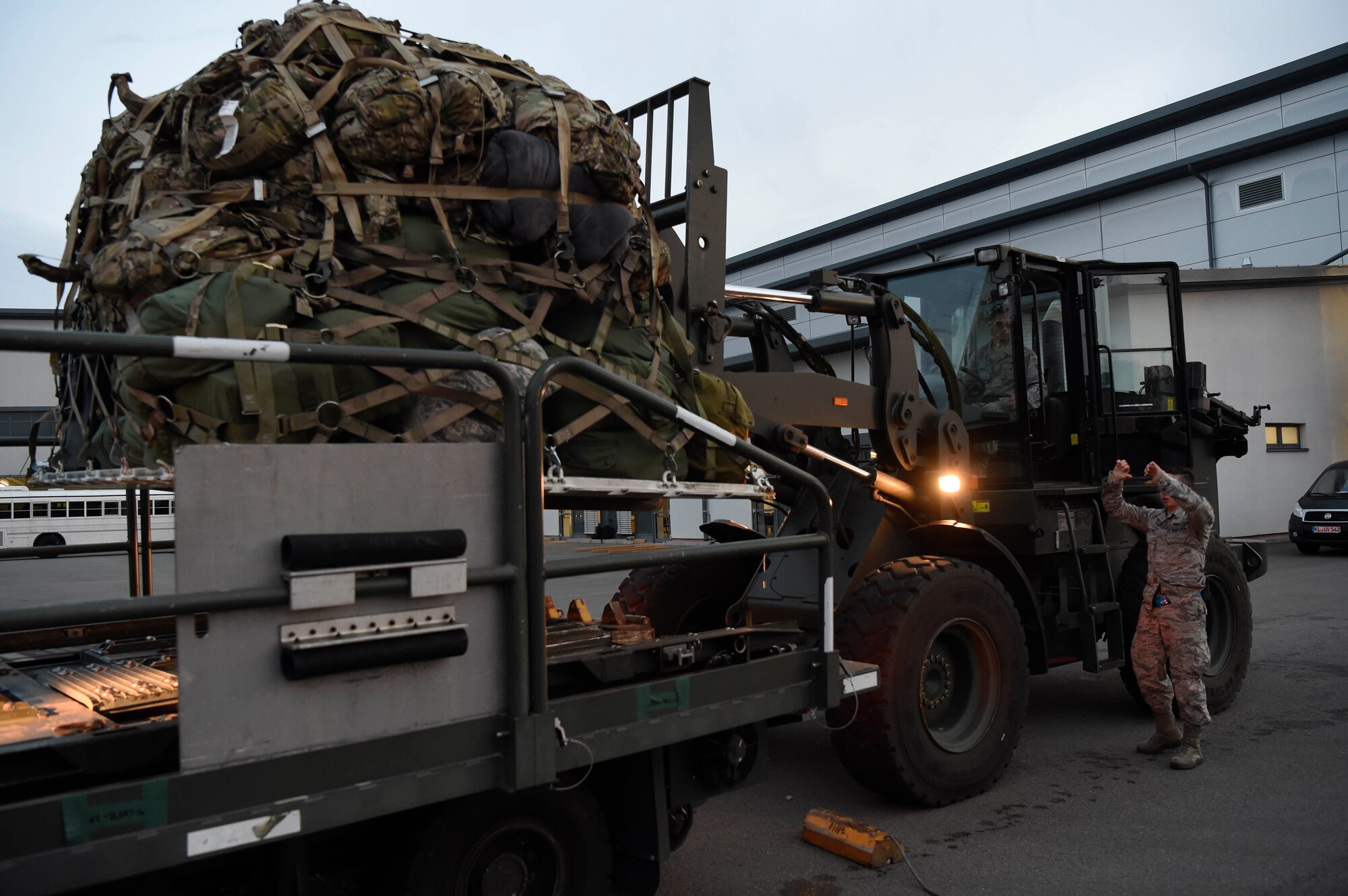 435 AEW, 86 LRS Airmen load pallets near the Ramstein Air Base flight line