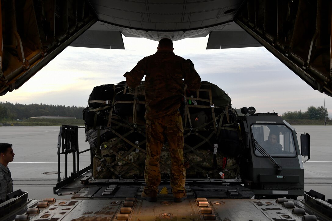 435 AEW, 86 LRS Airmen load pallets near the Ramstein Air Base flight line