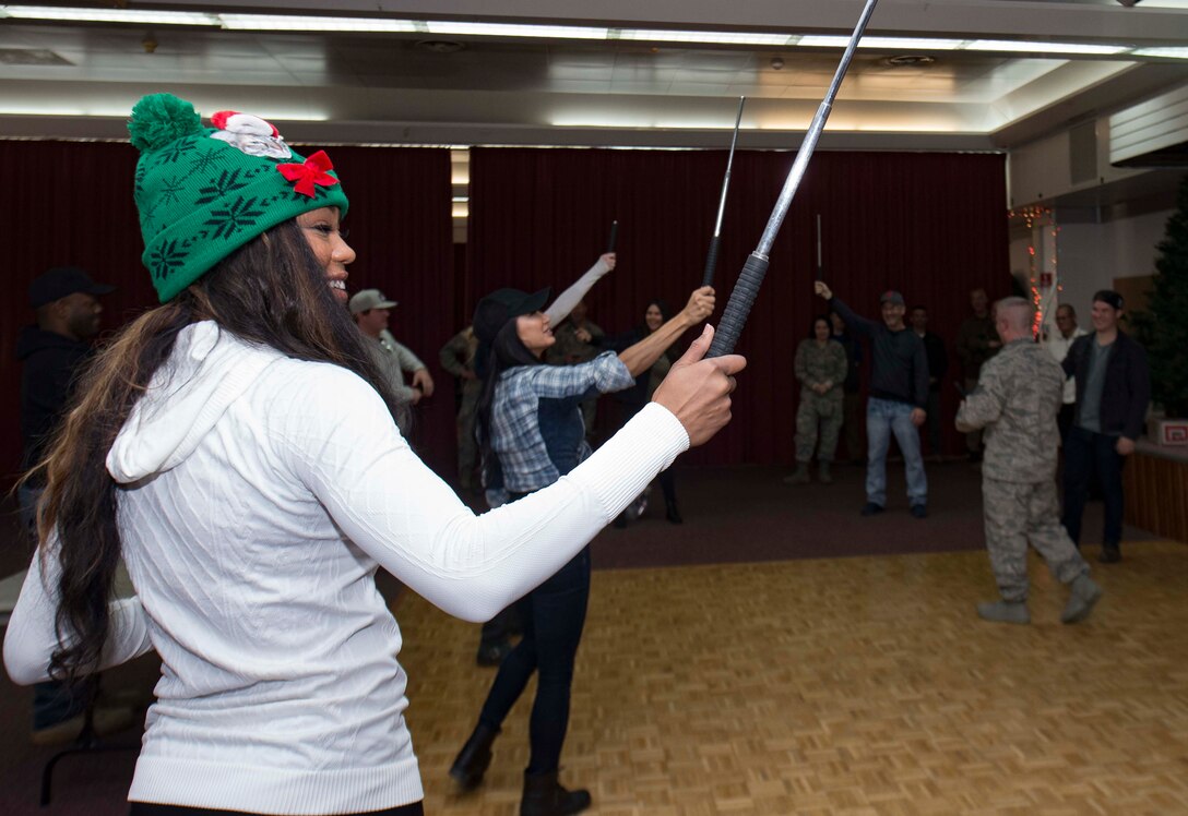 An arrival party greets U.S. Marine General Joseph Dunford, Chairman of the Joint Chiefs of Staff, on Morón Air Base, Spain, Dec. 21, 2017. Dunford and various entertainers toured Morón and engaged with Marines and Airmen during the 2017 United Services Organization Holiday Tour. (U.S. Air Force photo by Senior Airman Elizabeth Baker)