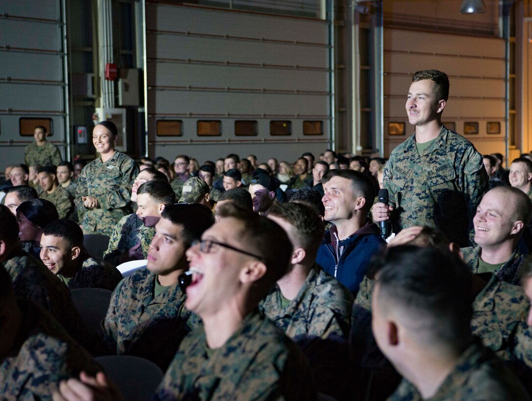Adam DeVine, actor-comedian, speaks to service members during the 2017 United Services Organization Holiday Tour on Morón Air Base, Spain, Dec. 21, 2017. The annual holiday tour is designed to bring a piece of home to service members sacrificing to serve overseas. (U.S. Air Force photo by Senior Airman Elizabeth Baker)