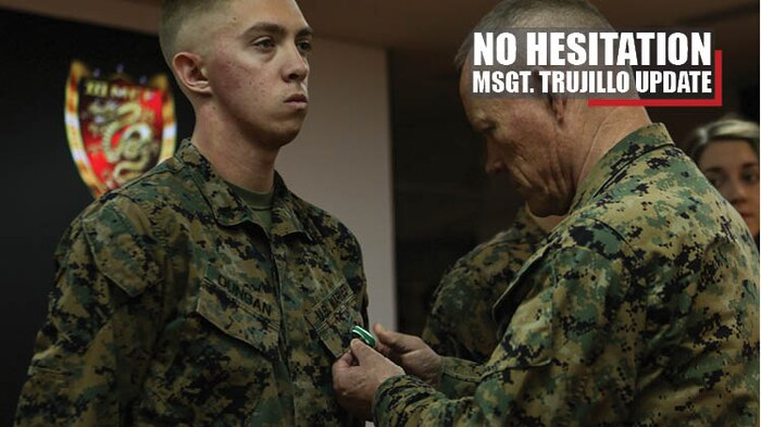 Lt. Gen. Lawrence D. Nicholson, commanding general of III Marine Expeditionary Force, awards Cpl. Matthew Dungan with the Navy and Marine Corps Commendation Medal Jan. 3, 2018 at Camp Courtney, Okinawa, Japan. Dungan, a bulk fuel specialist with Bulk Fuel Company, 9th Engineer Support Battalion (ESB), 3rd Marine Logistics Group, received the award for aiding Master Sgt. Hector Trujillo, a motor transport maintenance chief with 9th ESB, who was injured at the scene of an accident on the Okinawa Expressway Dec. 1, 2017. (U.S. Marine Corps photo by Pfc. Jamin M. Powell)