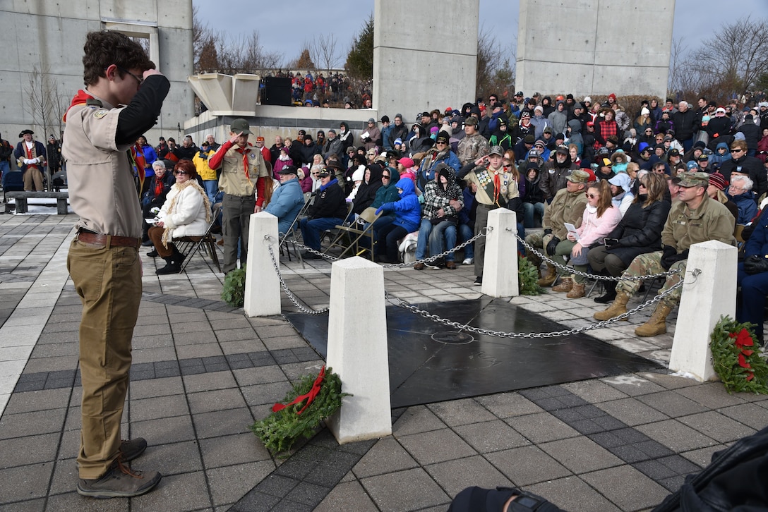 Boy Scout Volunteers demonstrate proper etiquette for placing wreaths during the Wreaths Across America Ceremony.