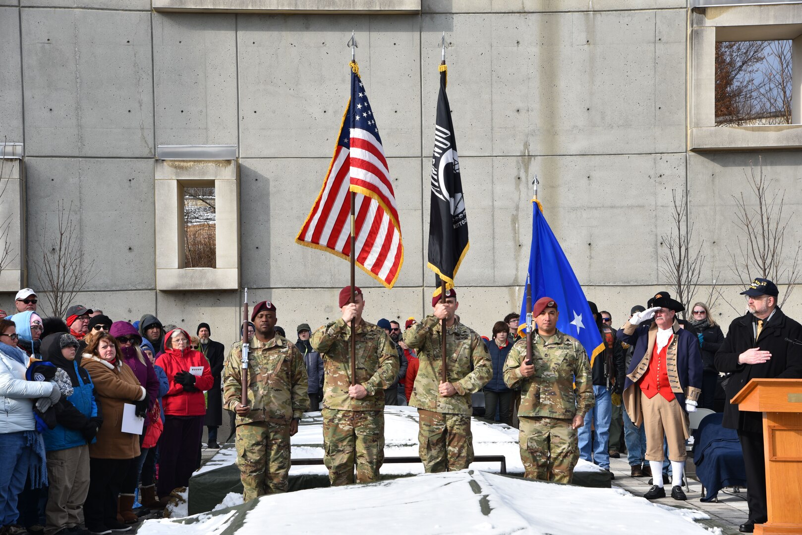 Boy Scout Volunteers demonstrate proper etiquette for placing wreaths during the Wreaths Across America Ceremony.