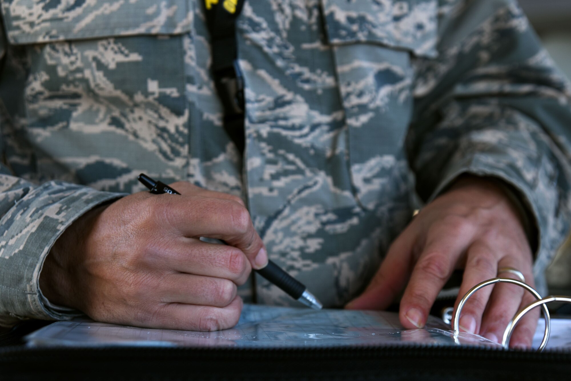 U.S. Air Force Master Sgt. Christopher Schneider, F-16 Viper Demonstration Team superintendent, reviews a 20th Aircraft Maintenance Squadron dedicated crew chief’s forms during a Proud Falcon Competition at Shaw Air Force Base, S.C., Dec. 21, 2017.