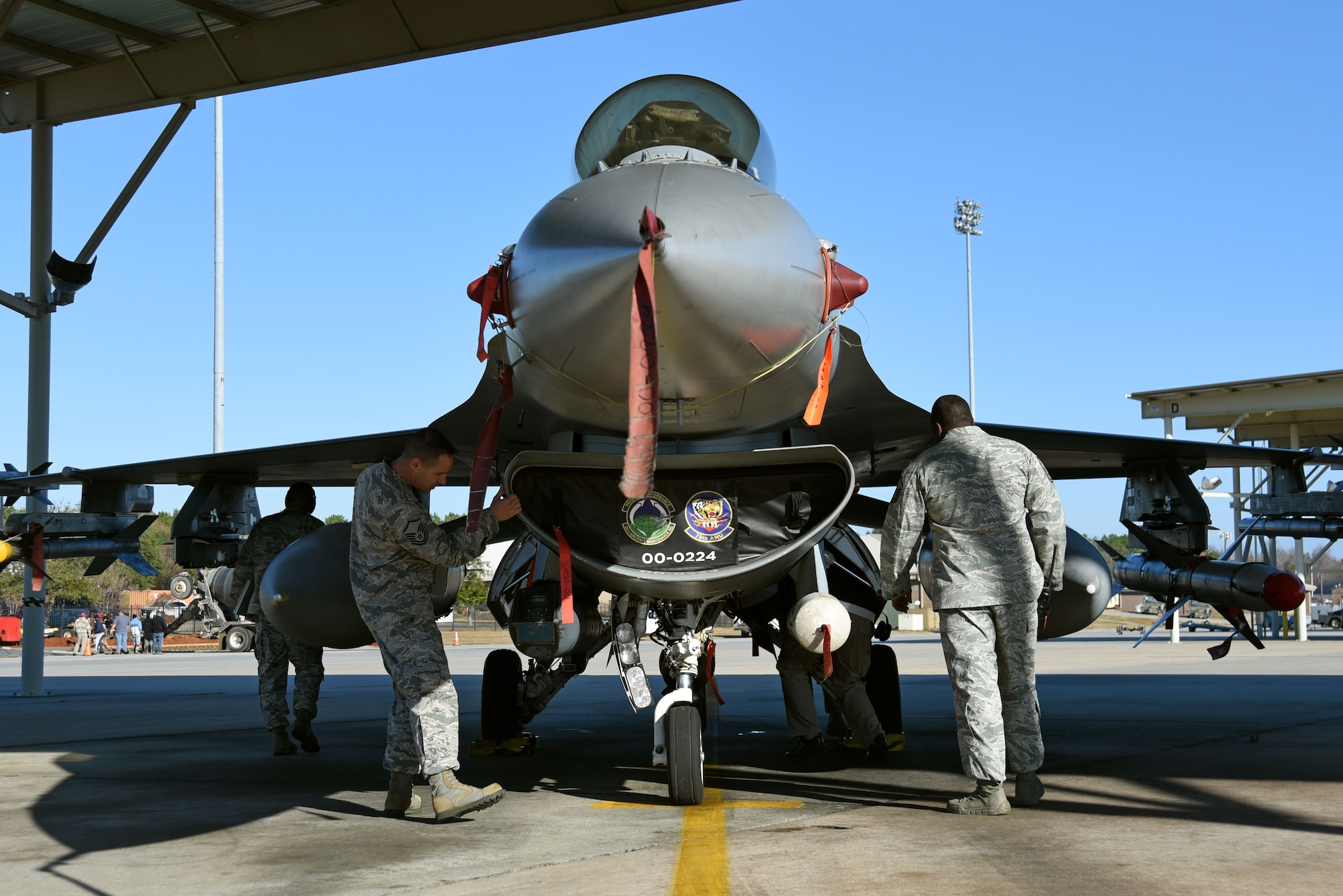 U.S. Airmen assigned to the 20th Fighter Wing visually inspect an F-16CM Fighting Falcon during a Proud Falcon Competition at Shaw Air Force Base, S.C., Dec. 21, 2017.