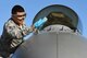 U.S. Air Force Staff Sgt. Pedro Cahua, 20th Aircraft Maintenance Squadron, 79th Aircraft Maintenance Unit, dedicated crew chief, cleans the canopy of an F-16CM Fighting Falcon before judges review the aircraft for a Proud Falcon Competition at Shaw Air Force Base, S.C., Dec. 21, 2017.