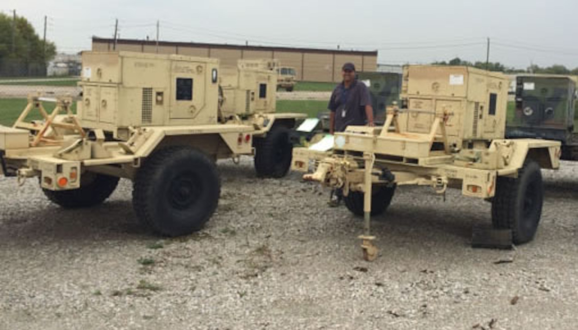 Cedrick Hancock, a disposal service representative stationed at DLA Disposition Services Crane, Indiana, stands next to some of the generators before shipping them to the Antigua and Barbuda in the Caribbean as part of the continuing hurricane relief effort of DLA.