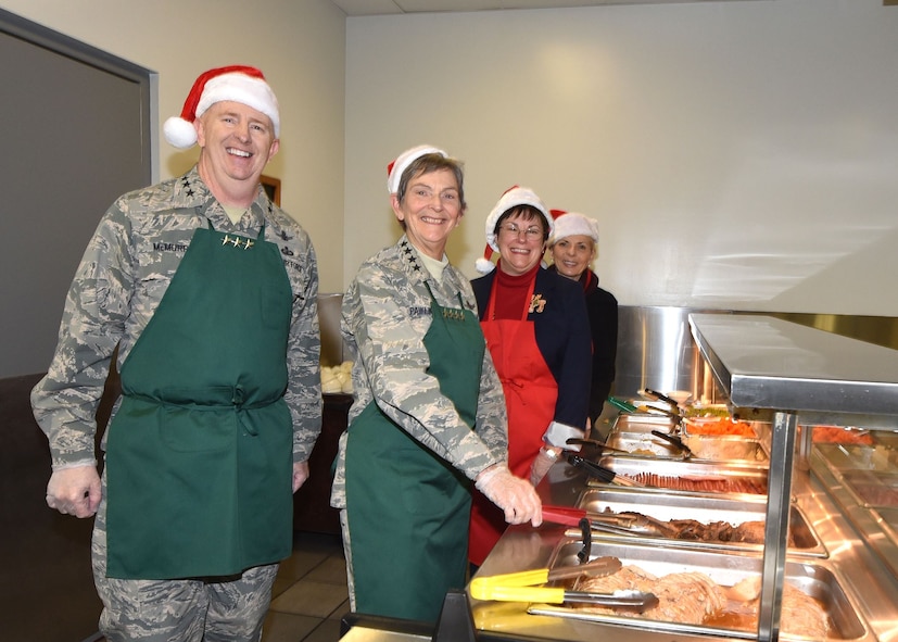 Gen. Pawlikowski, Lt. Gen. McMurry, and Ms. Young preparing to serve dinner.