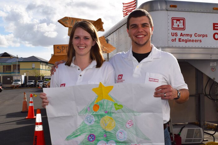 Leah and Evan Morgan, husband and wife team from Huntington District, Army Corps of Engineers, share the hand-drawn Christmas tree.