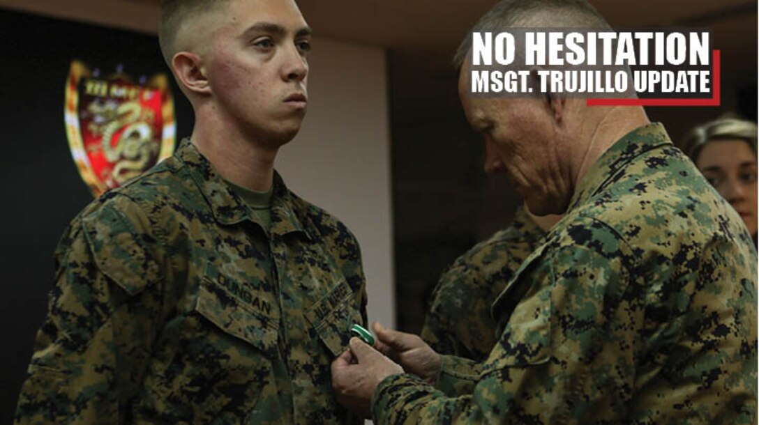 Lt. Gen. Lawrence D. Nicholson, commanding general of III Marine Expeditionary Force, awards Cpl. Matthew Dungan with the Navy and Marine Corps Commendation Medal Jan. 3, 2018 at Camp Courtney, Okinawa, Japan. Dungan, a bulk fuel specialist with Bulk Fuel Company, 9th Engineer Support Battalion (ESB), 3rd Marine Logistics Group, received the award for aiding Master Sgt. Hector Trujillo, a motor transport maintenance chief with 9th ESB, who was injured at the scene of an accident on the Okinawa Expressway Dec. 1, 2017. (U.S. Marine Corps photo by Pfc. Jamin M. Powell)
