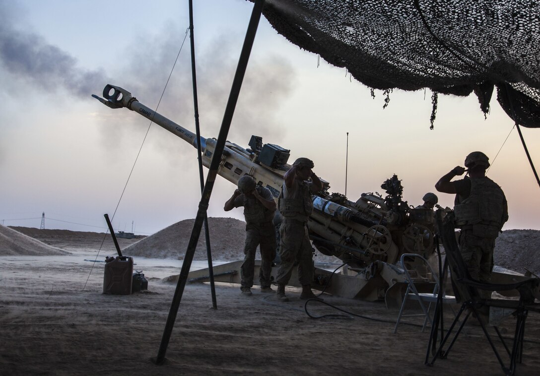 U.S. Army Paratroopers, deployed in support of Combined Joint Task Force – Operation Inherent Resolve and assigned to 2nd Battalion, 319th Airborne Field Artillery Regiment, 2nd Brigade Combat Team, 82nd Airborne Division, fire an M777 towed 155 mm howitzer in support of Iraqi security forces in northern Iraq, August 15, 2017. The 2nd BCT, 82nd Abn. Div., enables Iraqi security force partners through the advise and assist mission, contributing planning, intelligence collection and analysis, force protection and precision fires to achieve the military defeat of ISIS. CJTF-OIR is the global Coalition to defeat ISIS in Iraq and Syria. (U.S. Army photo by Cpl. Rachel Diehm.)