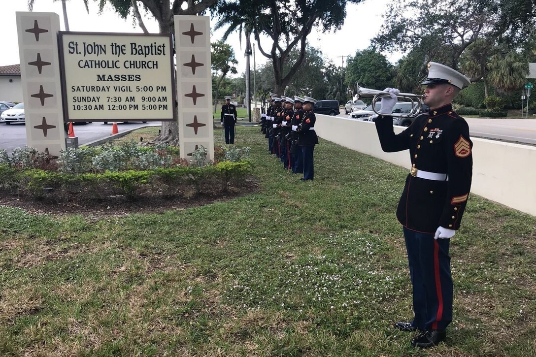 A Marine Reservist plays a bugle outside a church in Florida.