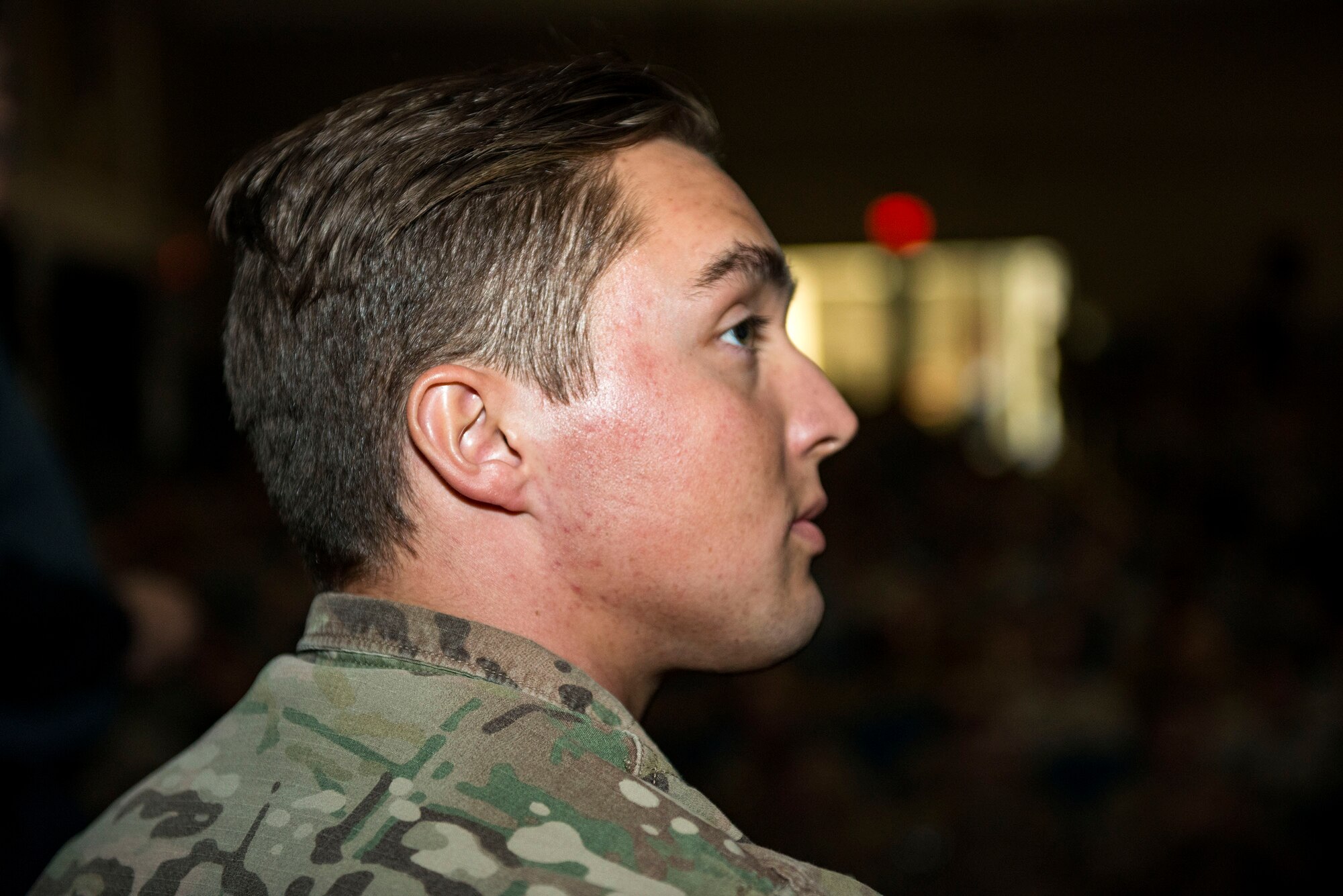 Senior Airman Cody Stoltenburg, 71st Rescue Squadron intelligence analyst, listens to a speech by safety training coordinators during a Street Smart presentation, Jan. 2, 2018, at Moody Air Force Base, Ga. The presenters utilized Airmen to simulate the potential results of drunk driving. Street Smart is a safety program designed to emphasize the dangers of making poor decisions and then driving a vehicle. (U.S. Air Force photo by Airman 1st Class Erick Requadt)