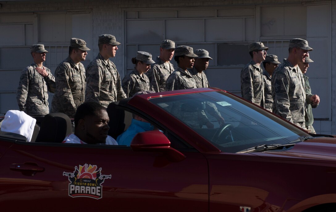 Airmen  from Luke Air Force Base walk through downtown Phoenix during the 2017 Fiesta Bowl Parade. Luke Airmen participated in the event which is part of Phoenix's Fiesta Bowl event the Fiesta Bowl game itself in which Luke Airmen will be honored.