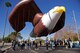 Participants walk through downtown Phoenix during the 2017 Fiesta Bowl Parade. Luke Airmen participated in the event which is part of Phoenix's Fiesta Bowl event the Fiesta Bowl game itself in which Luke Airmen will be honored.