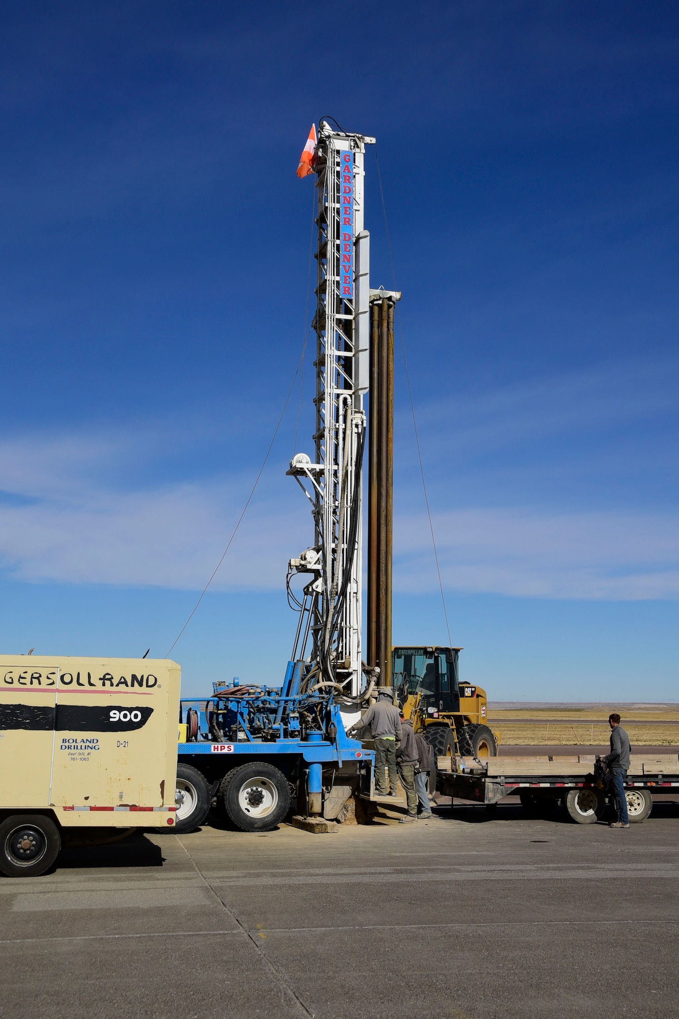 Contract environmental well drillers drill a water well on the ramp of the 120th Airlift Wing in Great Falls, Mont. Sept. 21, 2017. The wells will be tested and monitored for contaminants as part of the ongoing Installation Restoration Program on the Montana Air National Guard base. (U.S. Air National Guard photo/Senior Master Sgt. Eric Peterson)