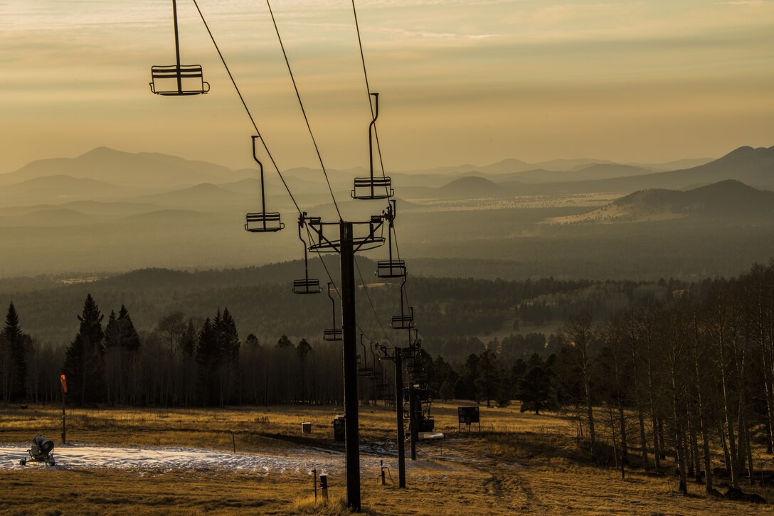 A ski lift at the Arizona Snowbowl overlooks the Coconino National Forest in Flagstaff Ariz., Dec. 16, 2017. The hills, lakes, and cliffs throughout the National Forest region offer numerous opportunities for hiking, biking, fishing, kayaking, and rock climbing for Airmen and their families visiting the Fort Tuthill Military Recreation Area. (U.S. Air Force photo/Airman 1st Class Caleb Worpel)