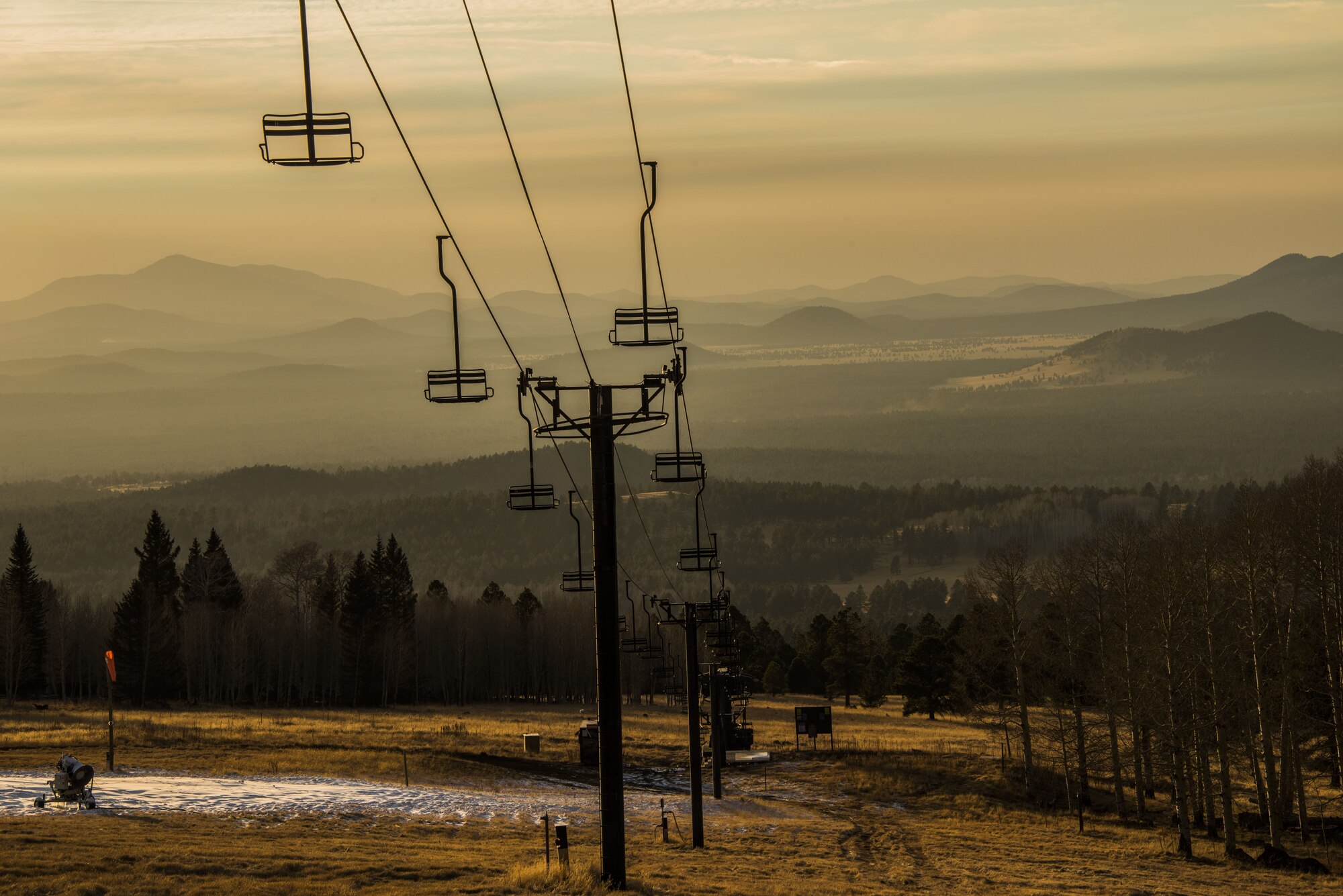 A ski lift at the Arizona Snowbowl overlooks the Coconino National Forest in Flagstaff Ariz., Dec. 16, 2017. The hills, lakes, and cliffs throughout the National Forest region offer numerous opportunities for hiking, biking, fishing, kayaking, and rock climbing for Airmen and their families visiting the Fort Tuthill Military Recreation Area. (U.S. Air Force photo/Airman 1st Class Caleb Worpel)