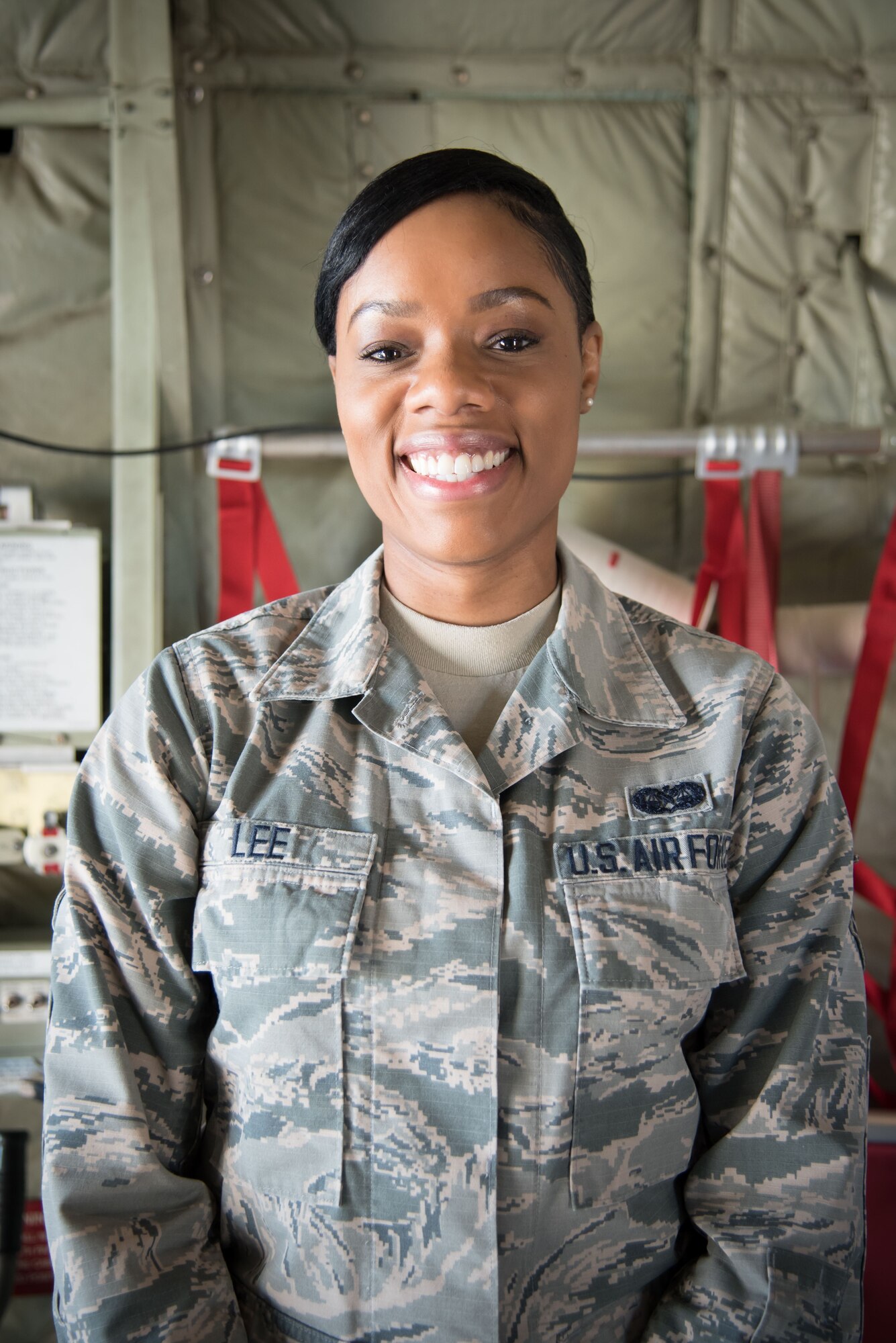 Senior Airman LaToya Lee, 403rd Wing Judge Advocate office paralegal, poses for a photo inside a C-130J Super Hercules aircraft Oct. 25, 2017 at Keesler Air Force Base, Mississippi. (U.S. Air Force photo by Staff Sgt. Heather Heiney)