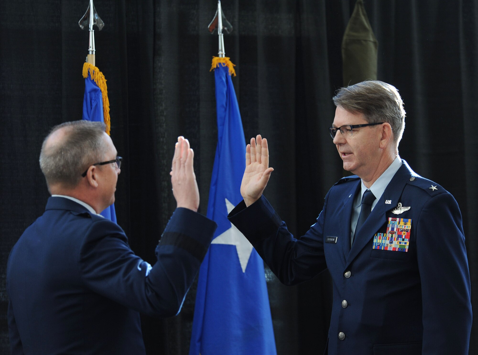 U.S. Air Force Brig. Gen. James “Bob” Stevenson Jr. is administered the Oath of Office by Maj. Gen. Daryl Bohac, Nebraska adjutant general, following his promotion to general officer and assumption of the position of assistant adjutant general for air of the Nebraska Air National Guard during a formal ceremony held Dec. 2, 2016 at the Nebraska Joint Force Headquarters in Lincoln, Nebraska. All Airmen take an oath upon entry into the service. Officers take the Oath of Office upon commissioning and renew that oath with each promotion. Enlisted members take the Oath of Enlistment upon entry and again each time they re-enlist.
