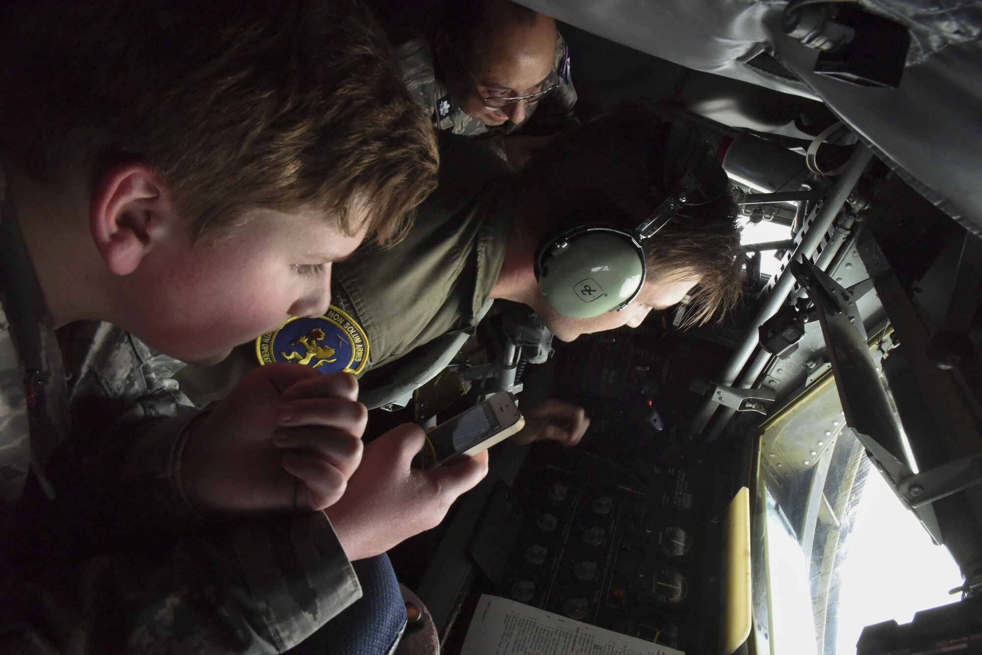A Civil Air Patrol cadet and senior member look on as Staff Sgt. F Jervis, 351st Air Refueling Squadron boom operator, refuels an F-16 Fighting Falcon over Germany, Dec. 19, 2017. The tanker offloaded 30 tons of fuel to six F-16s from the 52nd Fighter Wing at Spangdahlem Air Base, Germany. (U.S. Air Force photo by Senior Airman Kelly O’Connor)