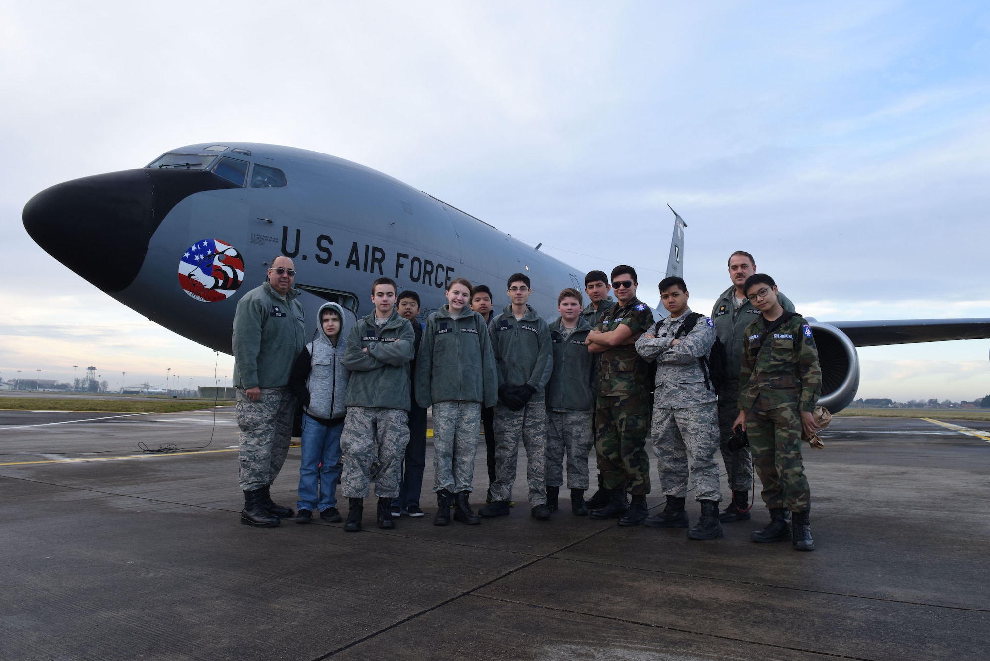 The Civil Air Patrol, ‘National Headquarters 128’ based in RAF Mildenhall, cadets and senior members pose for a group photo in front of a KC-135 Stratotanker following the air refueling mission Dec. 19, 2017. The flight was three and a half hours long, and the mission was a complete success. (U.S. Air Force photo by Senior Airman Kelly O’Connor)