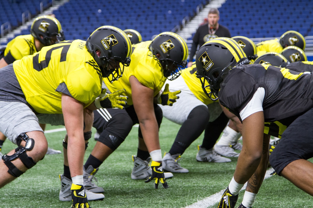U.S. Army All-American Bowl football players practice in the Alamodome in San Antonio.