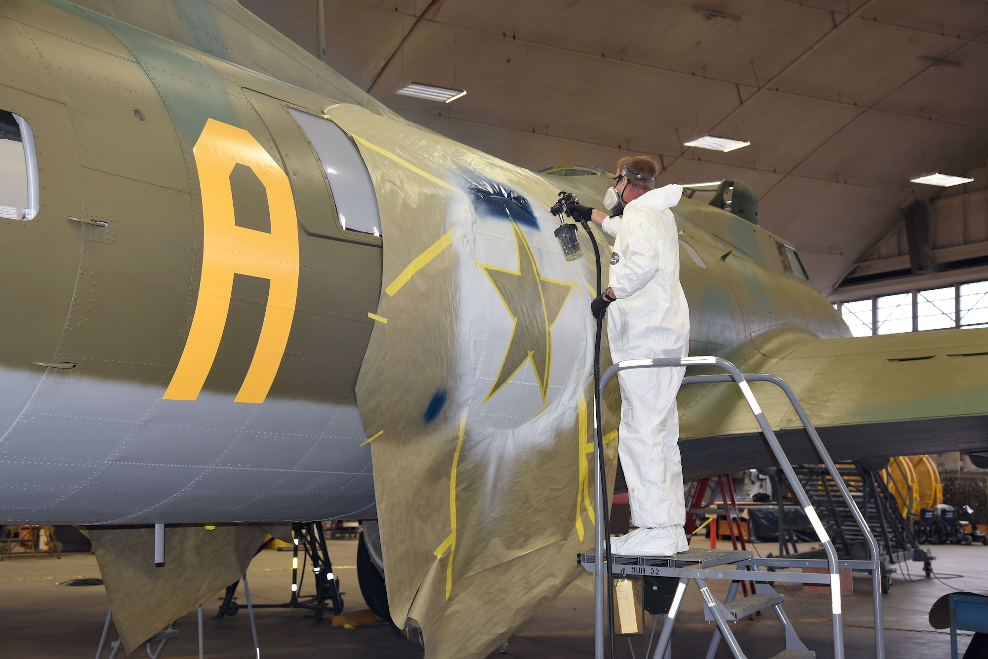 DAYTON, Ohio (12/06/2017) -- National Museum of the U.S. Air Force restoration crews continue the painting process on the Boeing B-17F Memphis Belle™. Plans call for the aircraft to be placed on permanent public display in the WWII Gallery here at the National Museum of the U.S. Air Force on May 17, 2018. (U.S. Air Force photo by Ken LaRock)