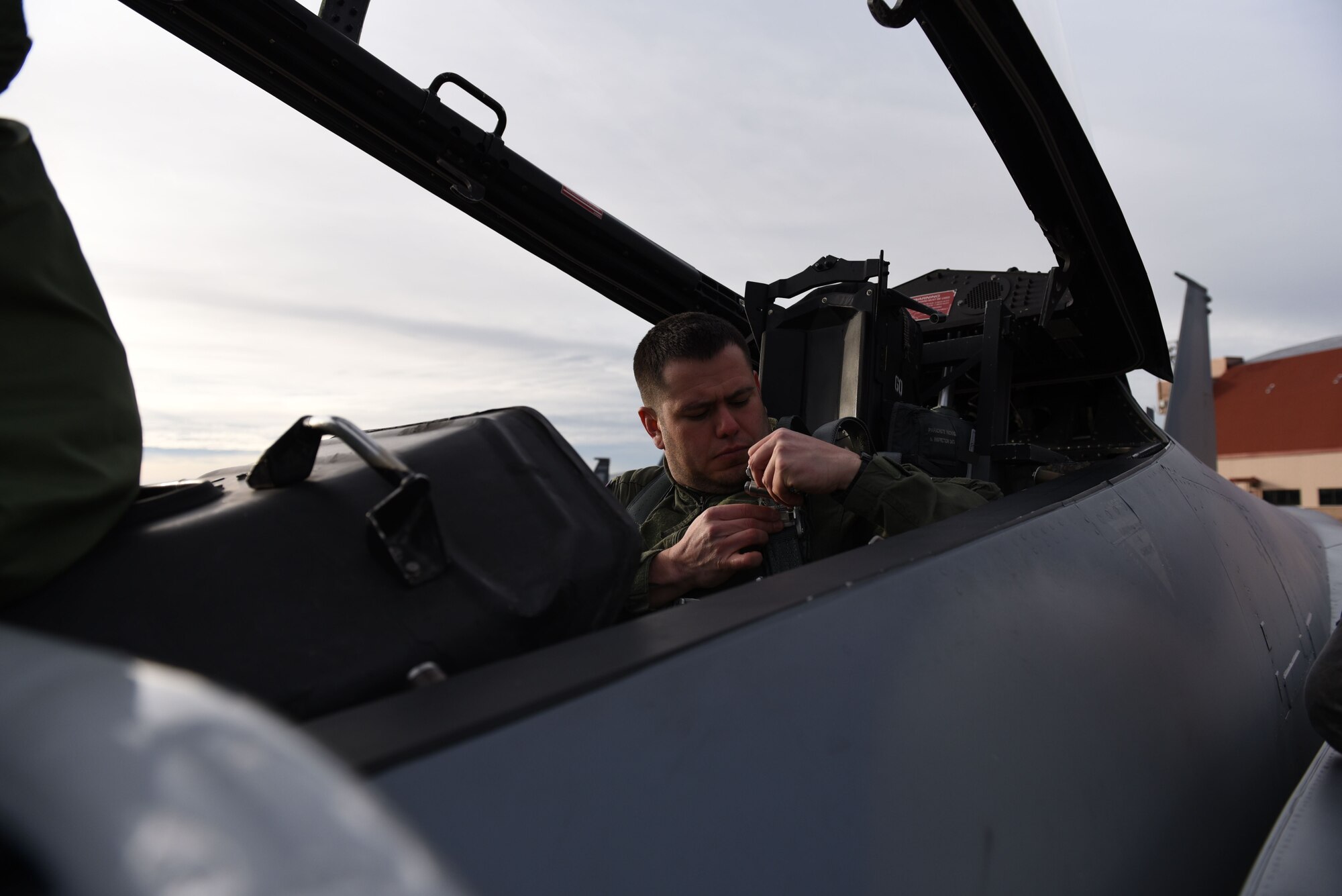 A.J. Davila, a local college adjunct professor and veteran’s affairs advocate, straps into the back seat of an F-15 D-model just prior to taking off as part of a new program called Hometown Heroes at the 173rd Fighter Wing in Klamath Falls, Ore., Jan. 3, 2018.