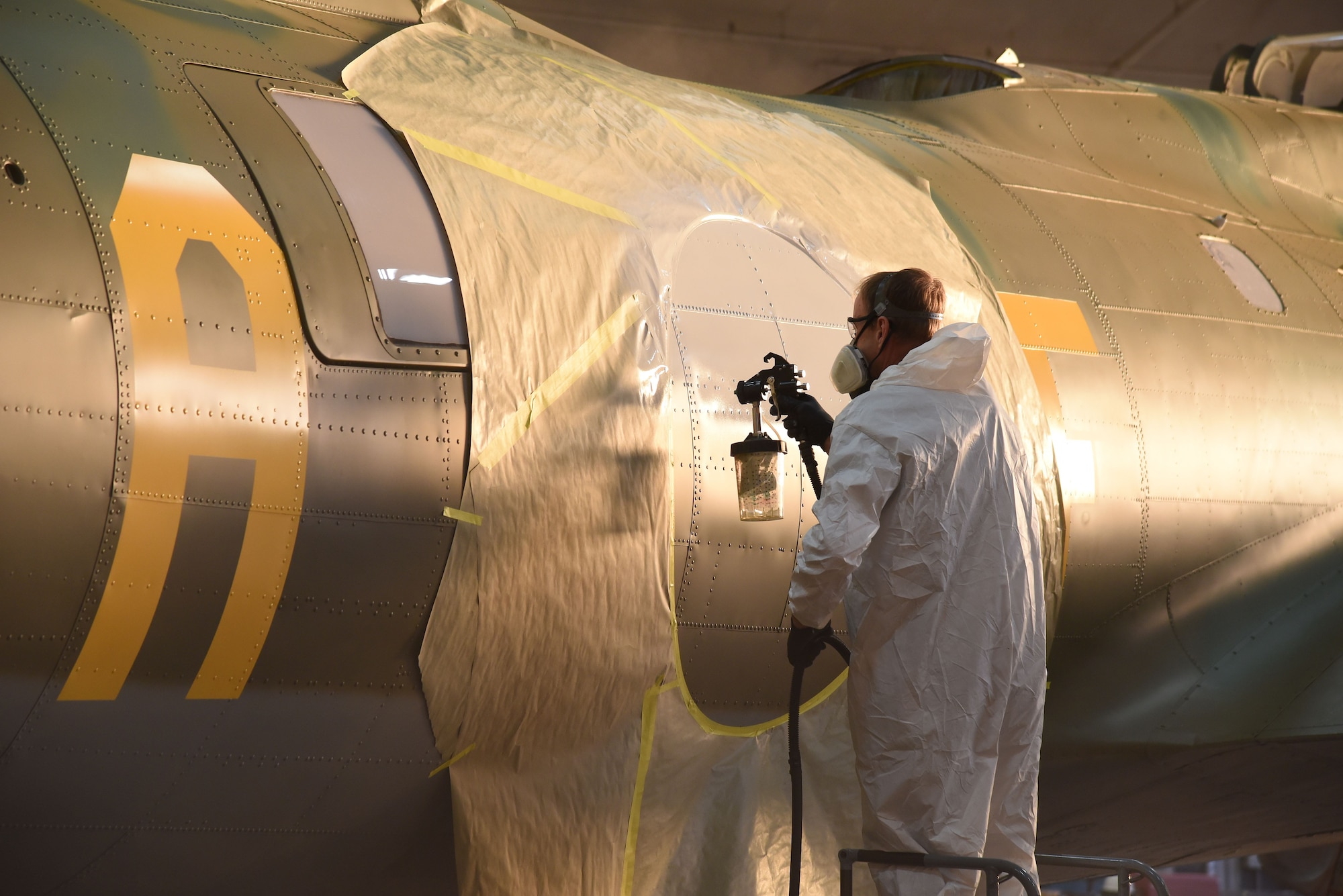 DAYTON, Ohio (12/06/2017) -- National Museum of the U.S. Air Force restoration crews continue the painting process on the Boeing B-17F Memphis Belle™. Plans call for the aircraft to be placed on permanent public display in the WWII Gallery here at the National Museum of the U.S. Air Force on May 17, 2018. (U.S. Air Force photo by Ken LaRock)