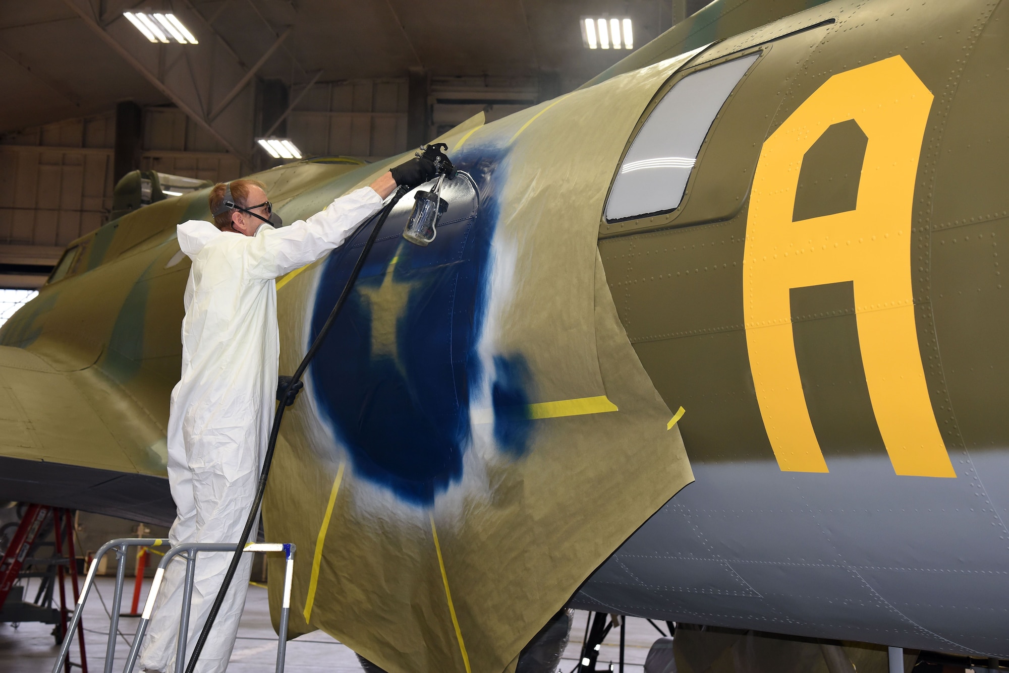 DAYTON, Ohio (12/06/2017) -- National Museum of the U.S. Air Force restoration crews continue the painting process on the Boeing B-17F Memphis Belle™. Plans call for the aircraft to be placed on permanent public display in the WWII Gallery here at the National Museum of the U.S. Air Force on May 17, 2018. (U.S. Air Force photo by Ken LaRock)