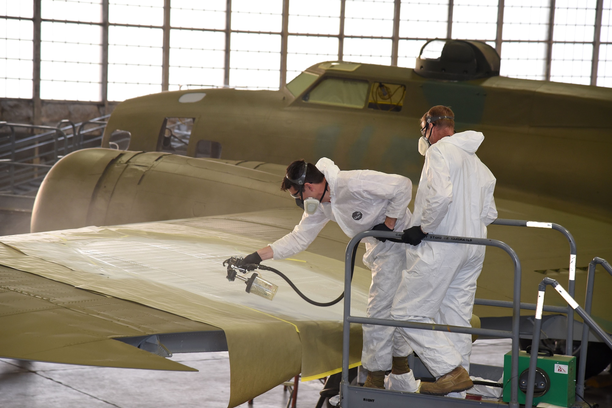 DAYTON, Ohio (12/06/2017) -- National Museum of the U.S. Air Force restoration crews continue the painting process on the Boeing B-17F Memphis Belle™. Plans call for the aircraft to be placed on permanent public display in the WWII Gallery here at the National Museum of the U.S. Air Force on May 17, 2018. (U.S. Air Force photo by Ken LaRock)