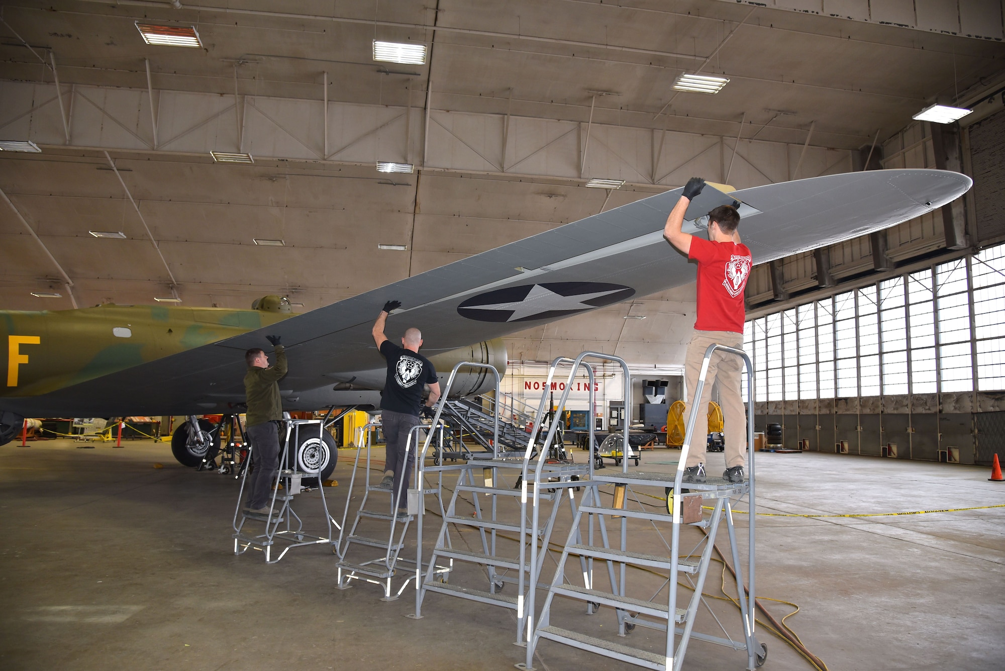 DAYTON, Ohio (12/28/2017) -- National Museum of the U.S. Air Force restoration crews install the flight control surfaces on the Boeing B-17F Memphis Belle™. Plans call for the aircraft to be placed on permanent public display in the WWII Gallery here at the National Museum of the U.S. Air Force on May 17, 2018. (U.S. Air Force photo by Ken LaRock)