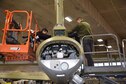 DAYTON, Ohio (12/28/2017) -- National Museum of the U.S. Air Force restoration crews install the flight control surfaces on the Boeing B-17F Memphis Belle™. Plans call for the aircraft to be placed on permanent public display in the WWII Gallery here at the National Museum of the U.S. Air Force on May 17, 2018. (U.S. Air Force photo by Ken LaRock)