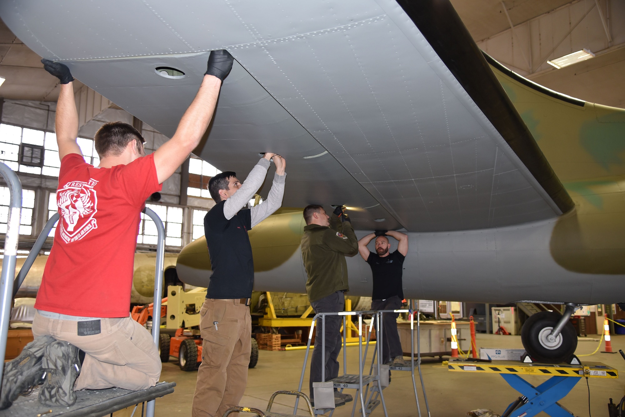 DAYTON, Ohio (12/28/2017) -- National Museum of the U.S. Air Force restoration crews install the flight control surfaces on the Boeing B-17F Memphis Belle™. Plans call for the aircraft to be placed on permanent public display in the WWII Gallery here at the National Museum of the U.S. Air Force on May 17, 2018. (U.S. Air Force photo by Ken LaRock)