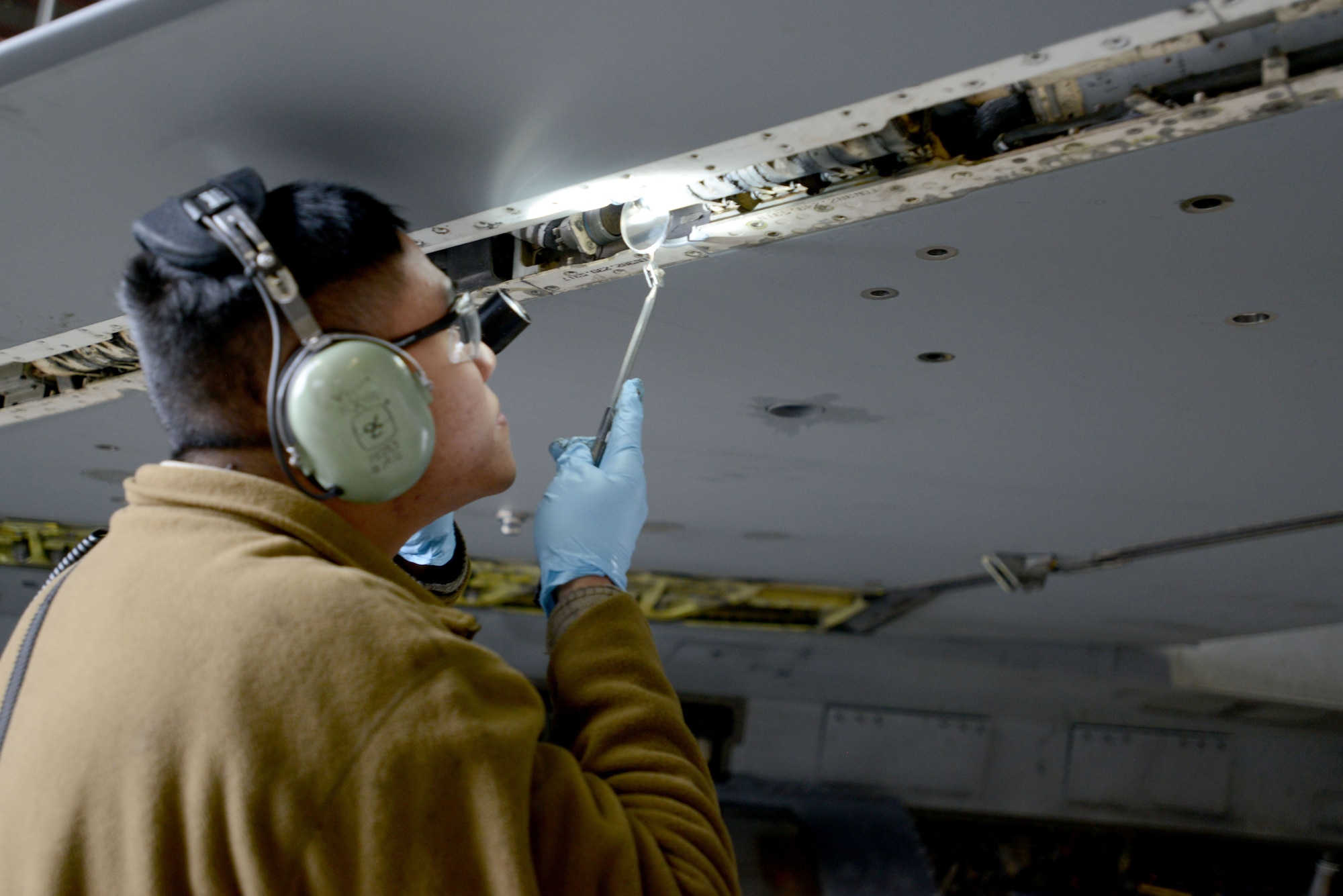 The wing is opened up and inspected for internal cracks to ensure structural integrity. (U.S. Air Force photo by Airman 1st Class Benjamin Ingold)