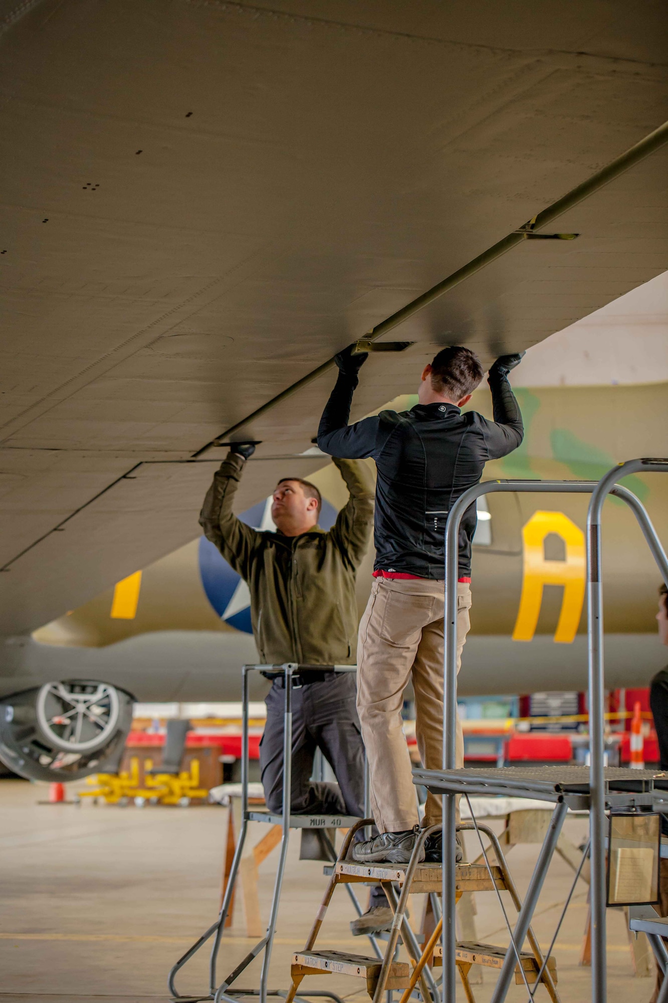 DAYTON, Ohio (01/04/2018) -- National Museum of the U.S. Air Force restoration crews installing the final control surfaces on the Boeing B-17F Memphis Belle™. Plans call for the aircraft to be placed on permanent public display in the WWII Gallery here at the National Museum of the U.S. Air Force on May 17, 2018. (U.S. Air Force photo by Ernie Muller)