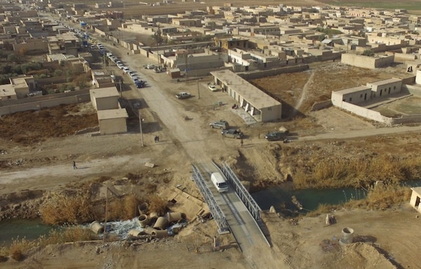 Engineers attached to the Special Operations Joint Task Force – Operation Inherent Resolve erected a bridge over the Euphrates River Dec. 27 in the Raqqah district, Syria. (Photo by Special Operations Joint Task Force - Operation Inherent Resolve)