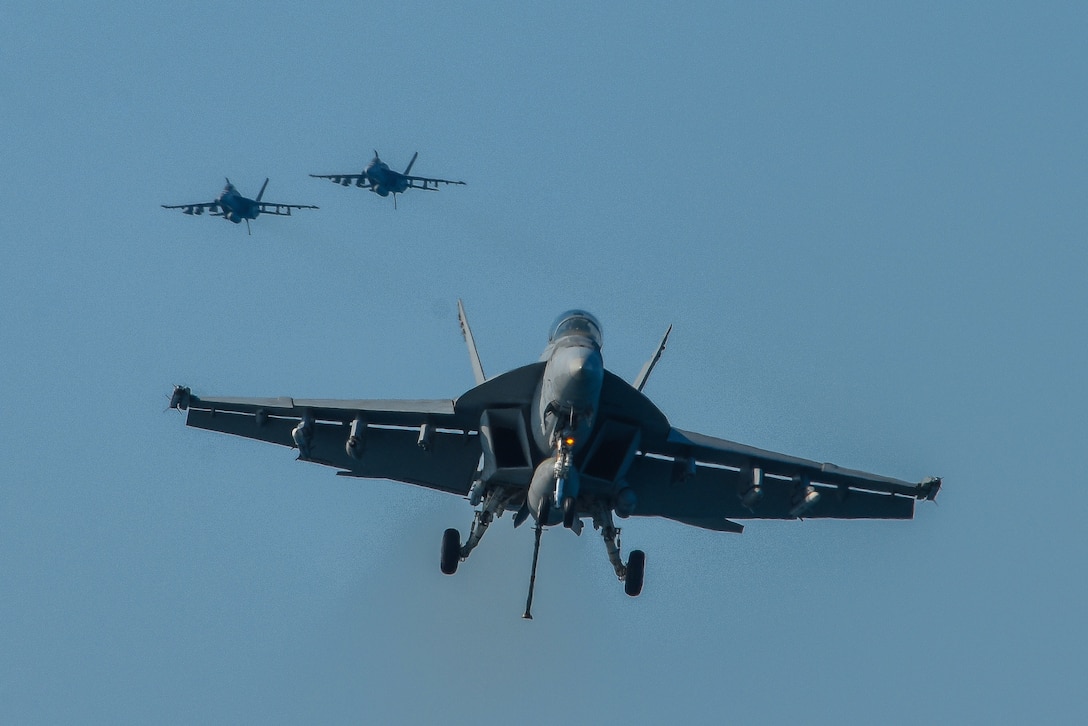 171217-N-GP724-1018 ARABIAN GULF (Dec. 17, 2017) An F/A-18F Super Hornet, assigned to the Fighting Redcocks of Strike Fighter Squadron (VFA) 22, makes a final approach to the aircraft carrier USS Theodore Roosevelt (CVN 71). Theodore Roosevelt and its carrier strike group are deployed to the U.S. 5th Fleet area of operations in support of maritime security operations to reassure allies and partners and preserve the freedom of navigation and the free flow of commerce in the region. (U.S. Navy photo by Mass Communication Specialist 3rd Class Alex Perlman/Released)