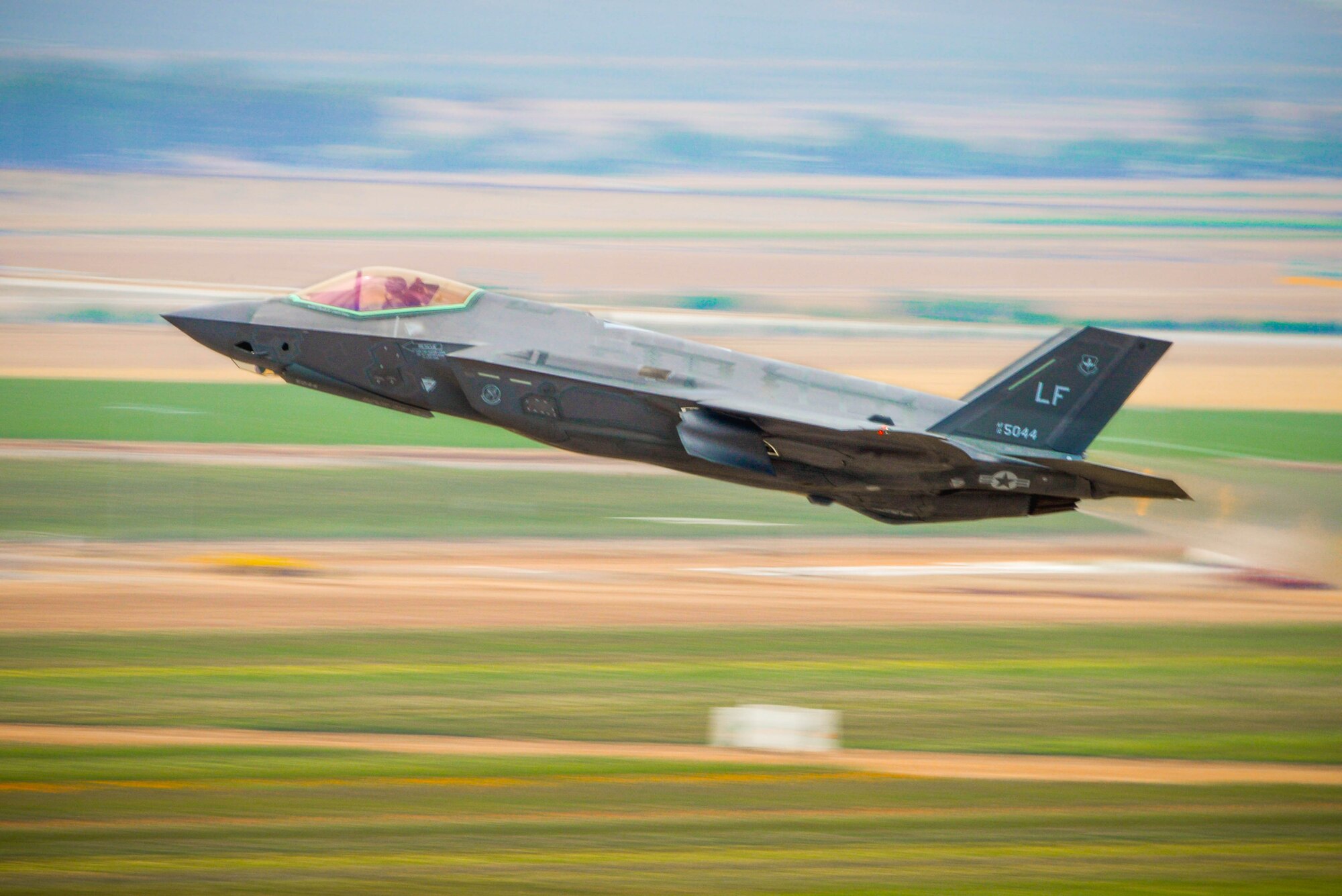 A 56th Fighter Wing F-35A Lightning II pilot takes off from Luke Air Force Base, Ariz., July 17, 2017. F-35 basic course students took part in a two and a half week, four flight phase replicating a wartime environment designed to test their training and skills. Today’s flight featured six F-35’s facing off against eight F-16 Fighting Falcons in defensive counter air attack operation measures. The students will be the first ever to graduate from a course designed specifically to utilize the mission set of the F-35. (U.S. Air Force photo/Airman 1st Class Caleb Worpel)