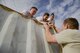 Arizona State University ROTC cadets help a teammate scale an obstacle during the 4th annual Luke Mudder competition at Luke Air Force Base, Ariz., Nov. 3, 2017. Working in teams of four, cadets competed for the fastest time to finish the 17 obstacle, mile and a half course. (U.S. Air Force photo/Airman 1st Class Caleb Worpel)