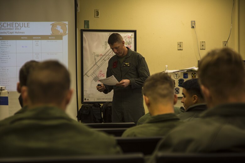 U.S. Marine Corps Capt. Aidan Steele, the acting operation duty officer for Marine Heavy Helicopter Squadron (HMH) 465, gives the flight brief to the pilots and crew who are participating in the Deployment for Training at Marine Corps Air Station (MCAS) Yuma, Ariz., Dec. 9, 2017. HMH-465 arrived to MCAS Yuma, Nov. 29, 2017 to conduct training in support of Exercise Winter Fury. Exercise Winter Fury allows Marines to exercise the skills needed as the combat element of the Marine Air Ground Task Force during a combat deployment. (U.S. Marine Corps photo by Cpl. Isaac D. Martinez)