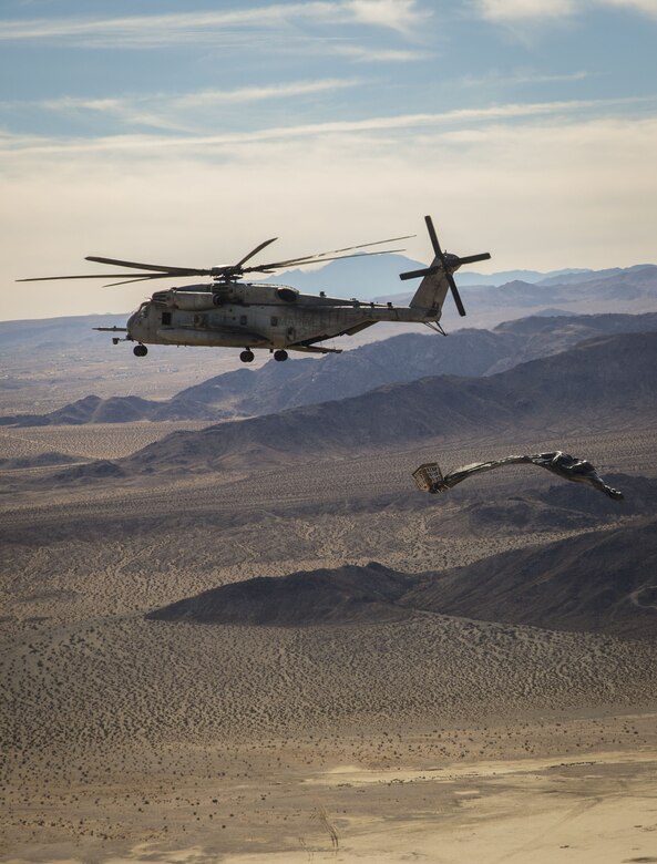 A CH-53E Super Stallion, assigned to Marine Heavy Helicopter Squadron (HMH) 465, conducts an airdrop above Marine Corps Air Ground Combat Center Twenty-nine Palms, Calif., Dec. 9, 2017. HMH-465 arrived to MCAS Yuma, Nov. 29, 2017 to conduct training in support of Exercise Winter Fury. Exercise Winter Fury allows Marines to exercise the skills needed as the combat element of the Marine Air Ground Task Force during a combat deployment. (U.S. Marine Corps photo by Cpl. Isaac D. Martinez)