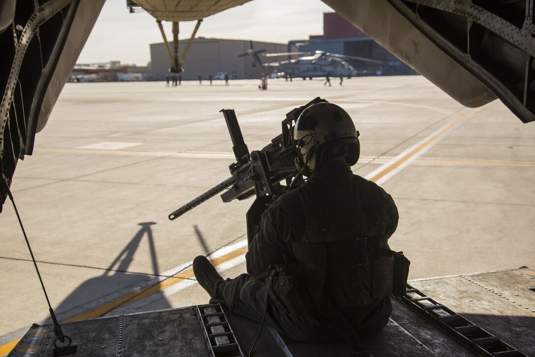 U.S. Marine Corps Cpl. Mitchell McCartney, a crew member assigned to Marine Heavy Helicopter Squadron (HMH) 465, sits at the rear of the CH-53E Super Stallion as it taxis off the flight line at Marine Corps Air Station (MCAS) Yuma, Ariz., Dec. 9, 2017. HMH-465 arrived to MCAS Yuma, Nov. 29, 2017 to conduct training in support of Exercise Winter Fury. Exercise Winter Fury allows Marines to exercise the skills needed as the combat element of the Marine Air Ground Task Force during a combat deployment. (U.S. Marine Corps photo by Cpl. Isaac D. Martinez)