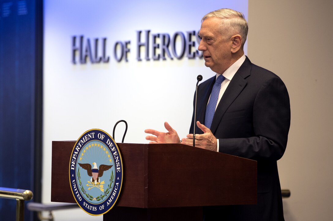 Defense Secretary James N. Mattis speaks at a podium.