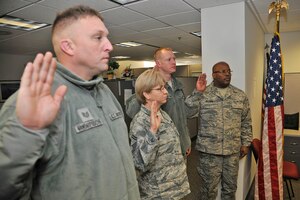 Members of the 127th Wing re-enlist in the Michigan Air National Guard at Selfridge Air National Guard Base, Mich., Jan. 6, 2018. Over the past year there were 280 enlistments and re-enlistments in the Michigan Air National Guard here.